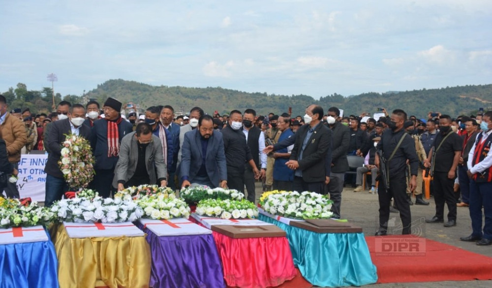 In honour of the innocent civilians killed at Oting, Chief Minister, Neiphiu Rio, his cabinet colleagues and thousand others attended the funeral service at Helipad Ground, Mon on December 6. (DIPR Photo)